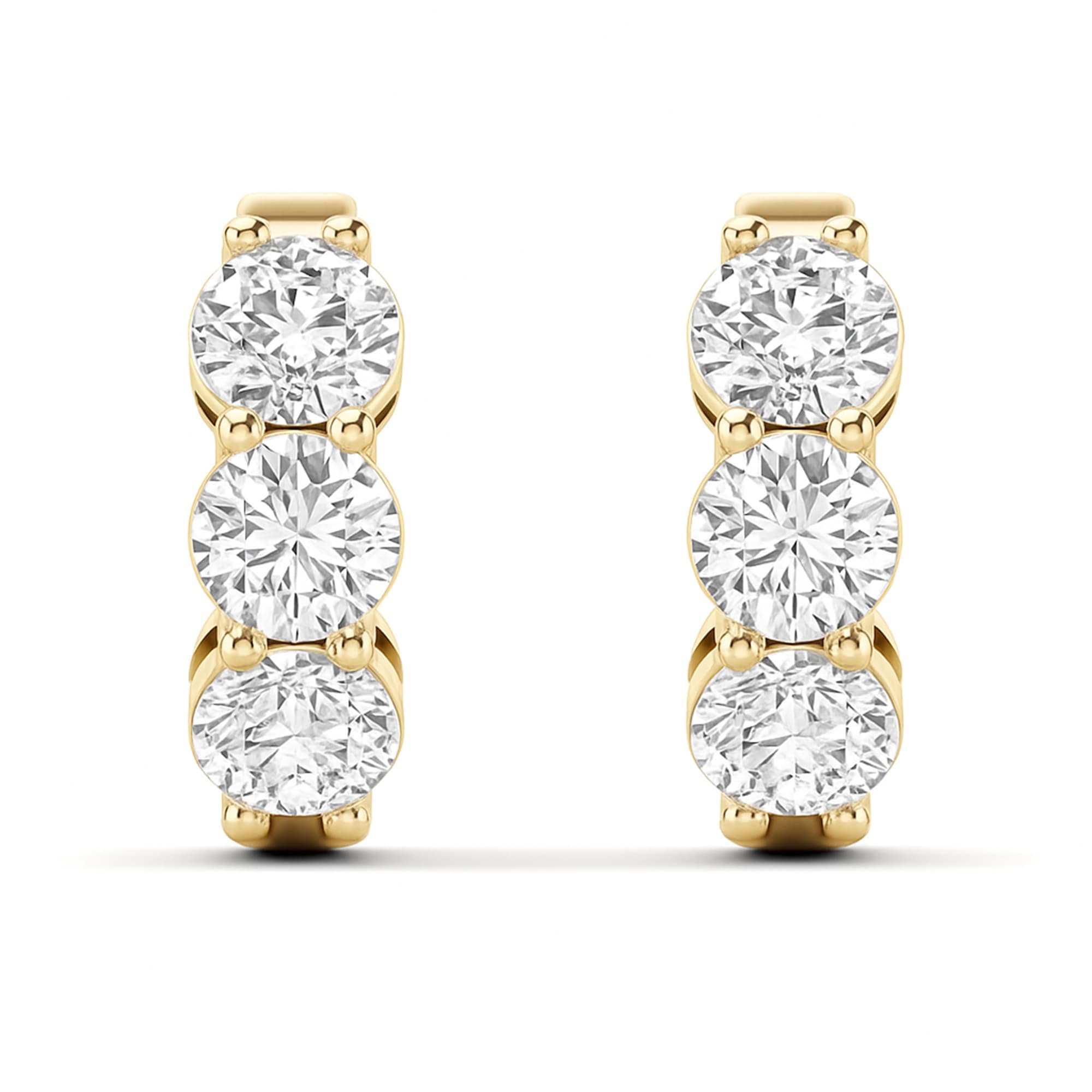 LGD 3-Stone Huggie Earrings (1.9 ct. tw.), On hand view in yellow gold