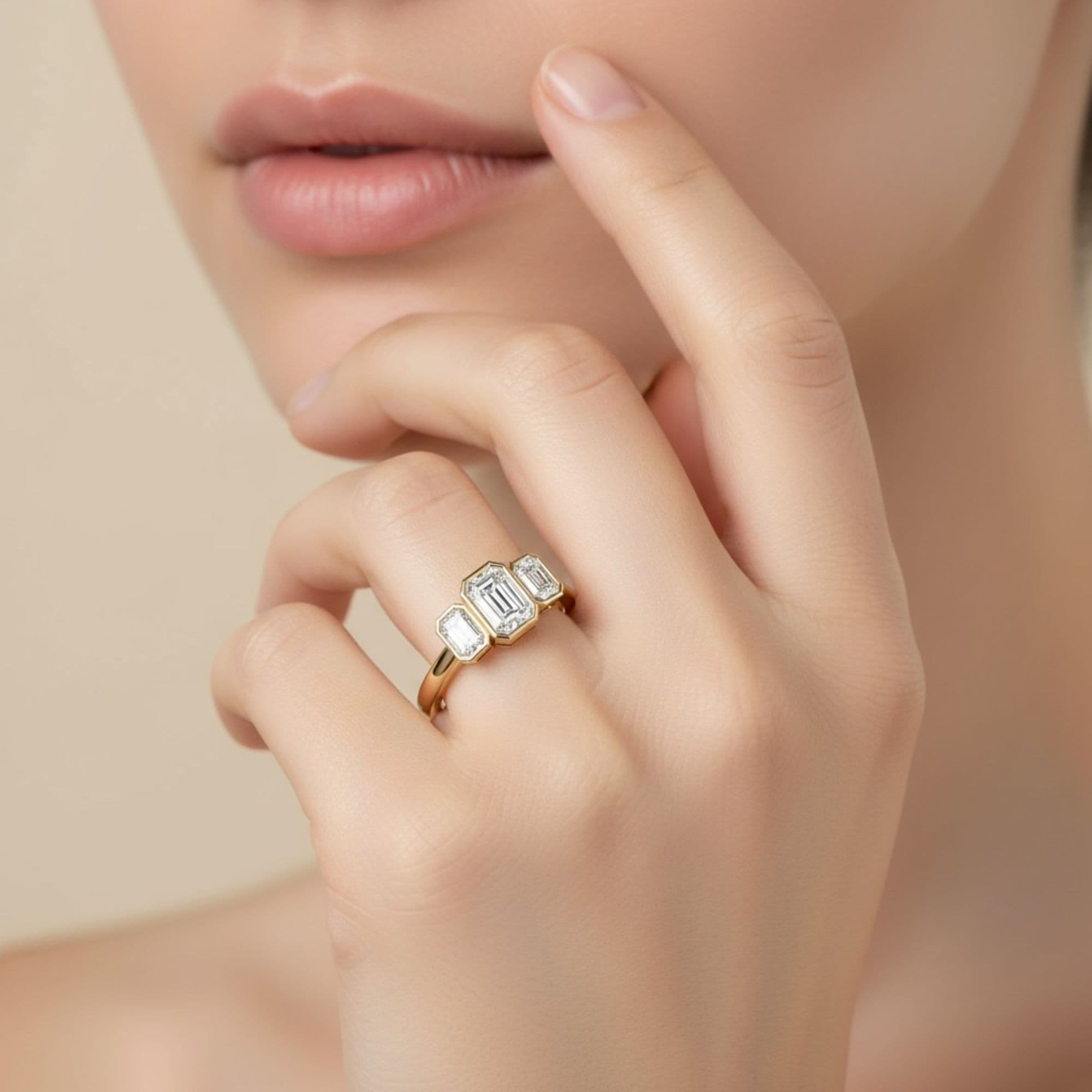 3 Stone Emerald Ring, style L0224R, Side view in yellow gold