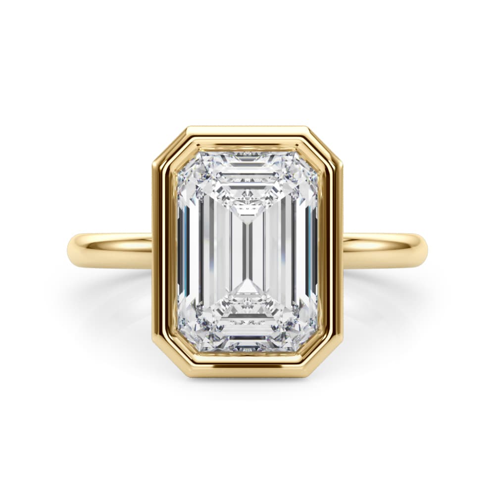 Solitaire Bezel Set Emerald Cut Engagement Ring, style L0264R, On hand view in yellow gold
